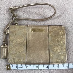 Gold coach wristlet